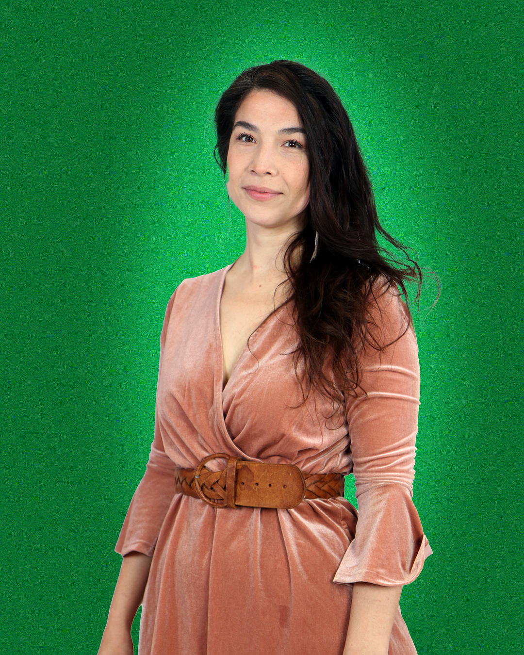 student jessica molina posing in front of a vibrant uo green solid color background