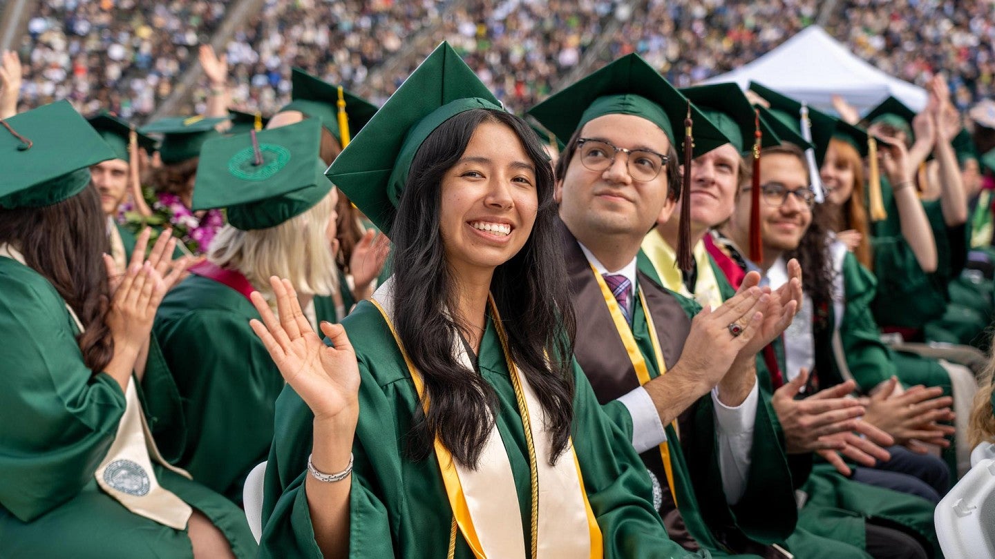 student success commencement photo of crowd of students