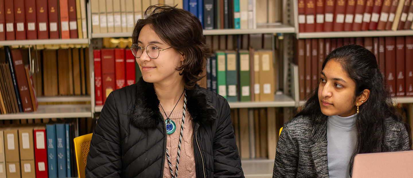 taec students in a library getting help