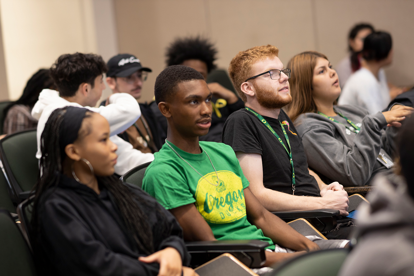 students sitting in classroom listening attentively