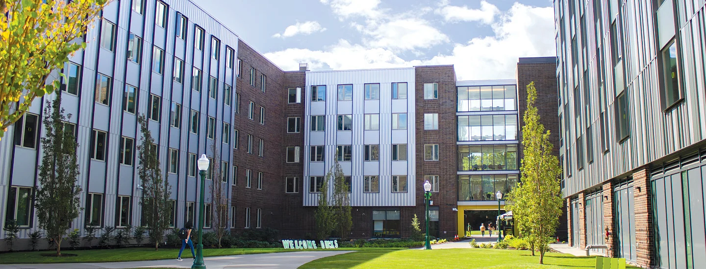 new student residence hall yasui hall on a partly cloudy day