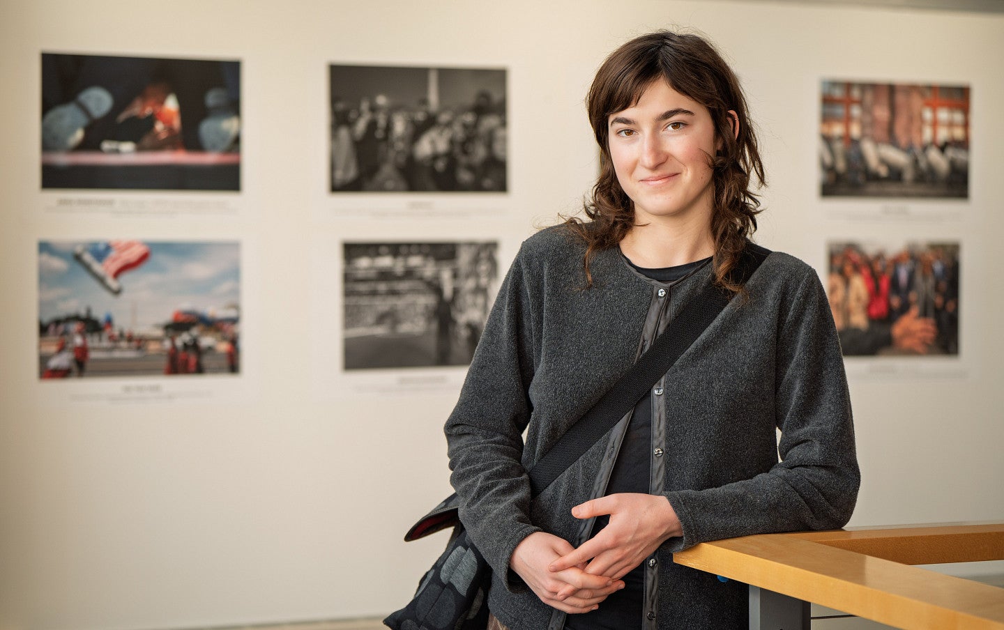 violet ashley smiling with blurry photos in background