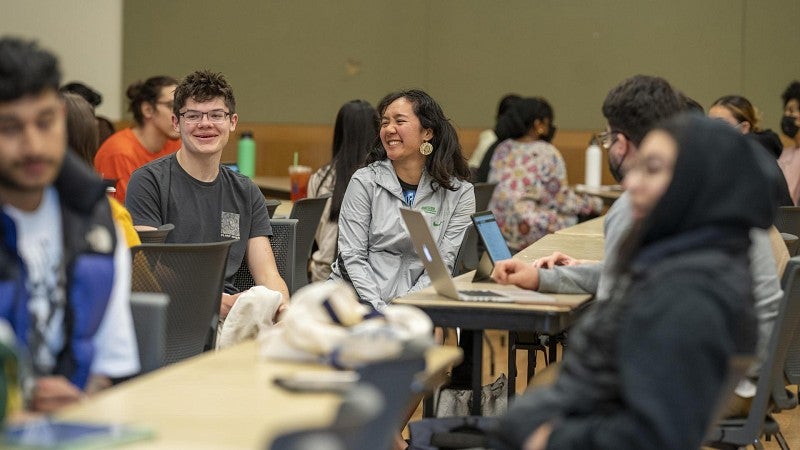 ducksrise students sitting at table and interacting