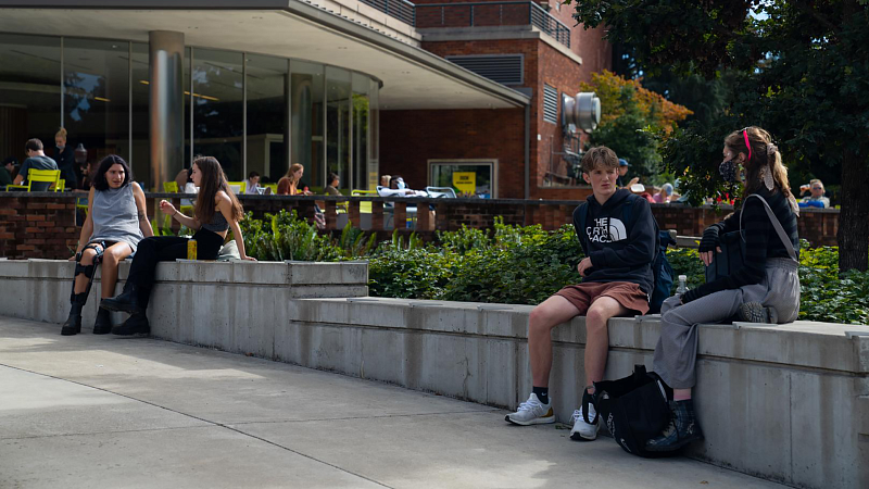 students at the emu sitting outside and talking