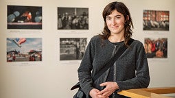 violet ashley smiling with blurry photos in background