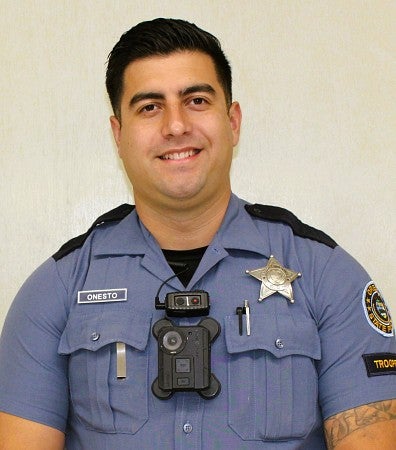 PathwayOregon alumni Arturo Onesto Oregon State Trooper headshot. He is wearing a blue police uniform.